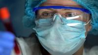Researcher analyzing blood serum